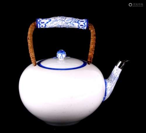 A large 20th century Meissen white glazed teapot, highlighted to the spout and floral knop in