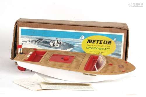 A Sutcliffe Meteor clockwork boat, complete with original box and sales receipt. Good working