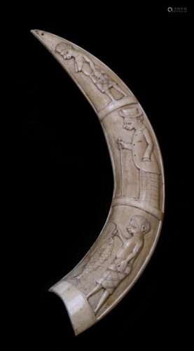 African/Tribal art. An early 20th century carved hippo tusk depicting three figures, one in