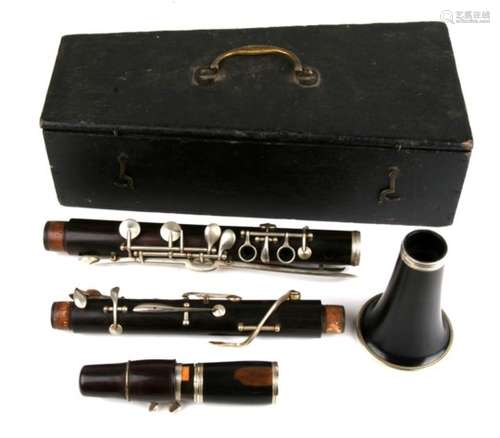 A Victorian rosewood clarinet in five sections. Original black carry box.