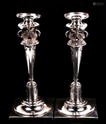 A pair of antique German silver candlesticks, the sconces supported by a pair of swans, the tapering