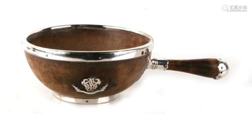 A Victorian turned walnut bowl with single carrying handle and silver plated mounts, having an