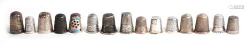 A group of silver thimbles.