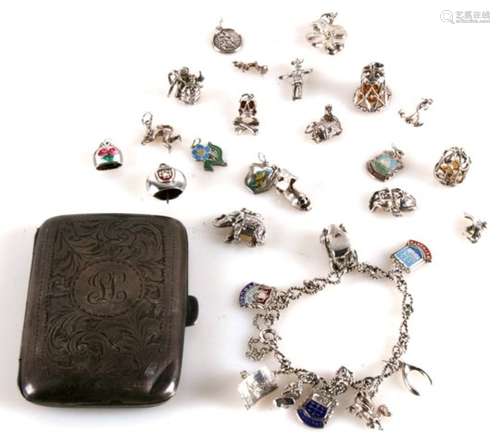 A silver charm bracelet; together with loose silver charms and a silver cigarette case, 115g.