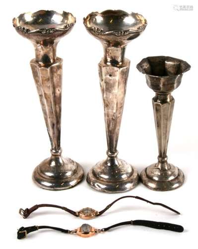 A pair of loaded silver trumpet vases; together with a similar smaller; a 14ct gold cased ladies