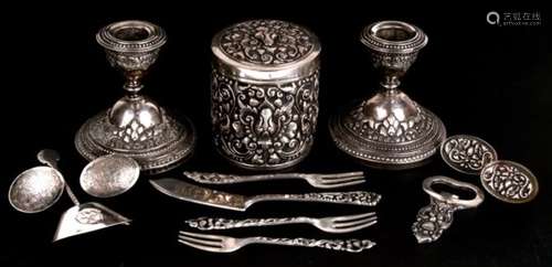 A quantity of Indonesian 800 grade silver items, including dwarf candlesticks, tea caddy, and