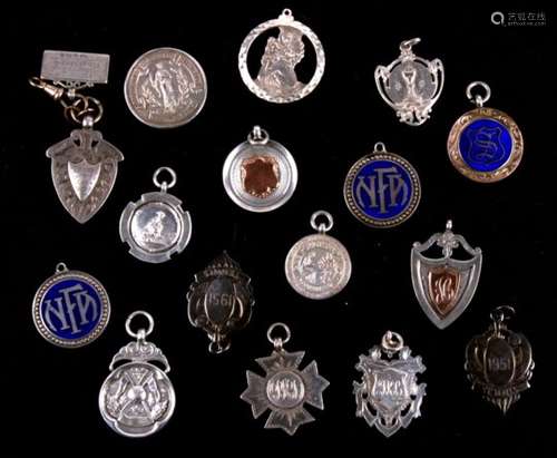 A collection of sixteen silver fob medals and medallions of various designs, hallmarks and makers.