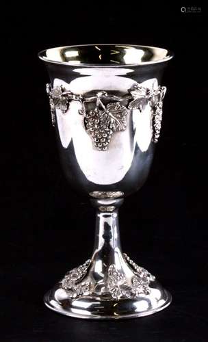 A 900 grade silver goblet with gilt interior, decorated to both base and bowl with applied grapes