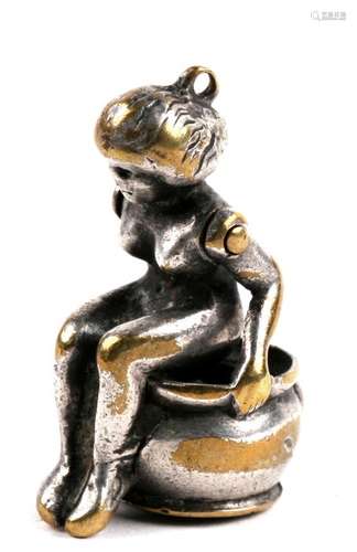 A novelty articulated figural silver plated fob cigar/cheroot cutter in the form of a seated naked