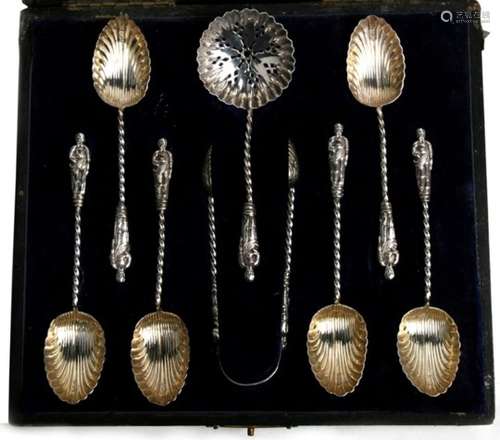 A cased set of six silver apostle spoons with shell bowls, matching sugar tongs, and a sifter spoon,