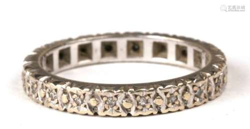 A 9ct white gold diamond set eternity ring, approx UK size 'K'.