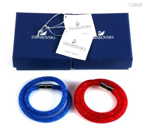 A Swarovski Stardust Red bracelet; together with a similar in blue, both boxed (2).