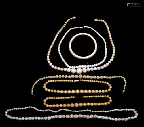 A quantity of early 20th century ivory necklaces.