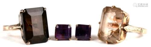 A 14ct gold dress ring set with a large rectangular smoky quartz; together with another similar,