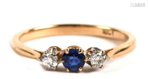 An 18ct gold, sapphire and diamond three stone ring, 2.5g. Approx.UK size P.