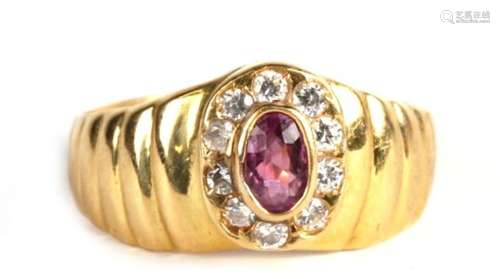 An 18ct gold, amethyst and diamond cluster ring, 3.2g. Approx. UK size J.