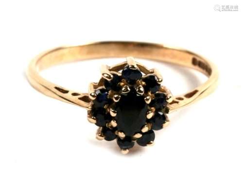 A 9ct gold and eleven stone sapphire cluster ring, 1.5g. Approx. UK size M.