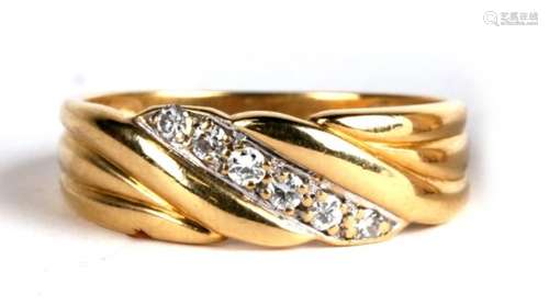 An 18ct gold and six diamond twist effect ring, 3.8g. Approx. UK size O