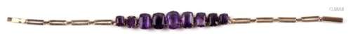 A 9ct gold (unmarked but tested) and graduated amethyst bracelet, 5.4g. 16cm (6.25 ins) long, 5.4g.