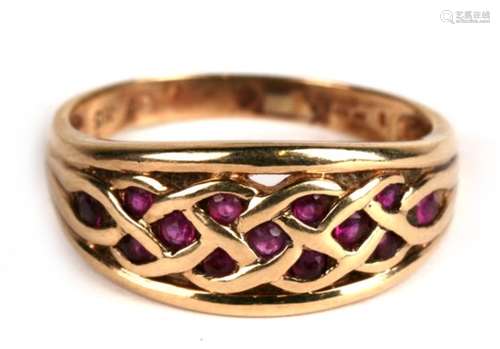 A 9ct gold ruby set Celtic design ring, approx UK size 'T'.