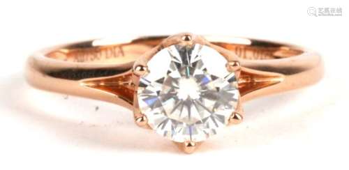 A 18ct gold solitaire ring. Approx UK size N. ( possibly a moissanite)