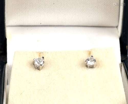 A pair of 18ct white gold diamond stud earrings.