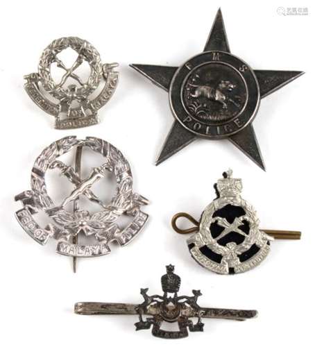 A group of Federation Of Malay Police items to include a silver hallmarked star badge.