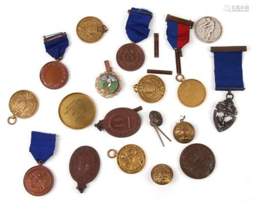 A quantity of military and shooting medallions.