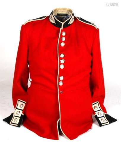 A late 20th century Scots Guards red tunic mounted on a wire torso, together with a reproduction