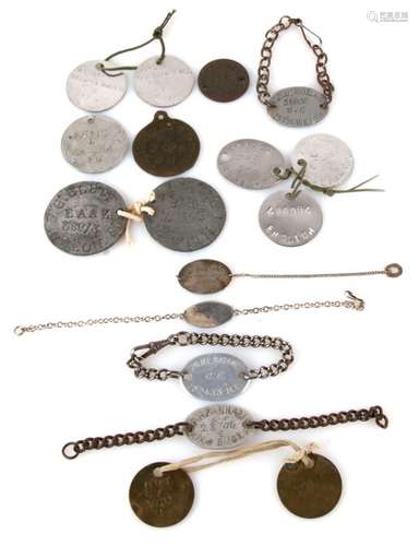 An assortment of white metal, silver and brass ID dog tags and identity bracelets including: L.