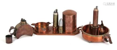 Three trench art style copper and brass table top petrol lighters including one formed as a