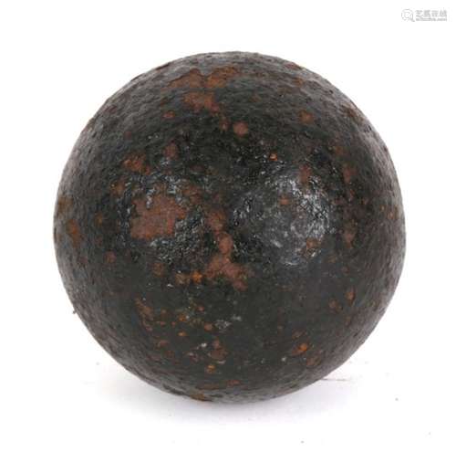 An 18th/19th century cast iron 5.5lb round shot cannon ball bomb with hollow interior. Approximate