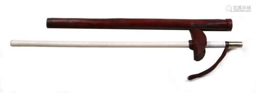 A 20th century mounted Police baton or truncheon in its rigid brown leather sheath. Overall length