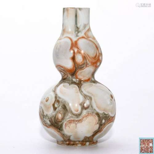 A Faux Marble Shaped Vase