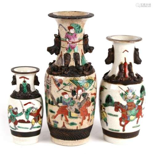 Three Chinese crackle glaze vases decorated with warriors, the largest 25cm (9.75ins) high.Condition