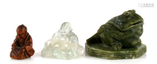 A Chinese carved rock crystal Buddha, 4cms (1.5ins) high; together with a green hardstone carving in