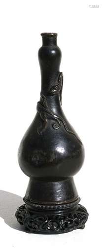 A Chinese Ming vase decorated with a chilong on a later intricately carved hardwood stand, 16cms (