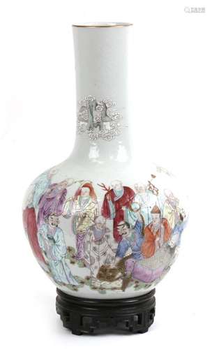 A Chinese bottle vase decorated with Immortals and animals, red seal mark to underside, on a pierced