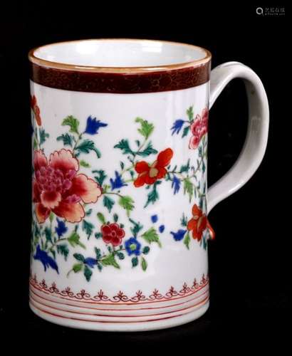 An 18th century Chinese famille rose tankard decorated with flowers, based on an English silver