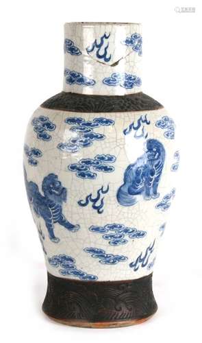 A 19th century Chinese crackle glaze vase decorated with shishi dogs amongst clouds, incised mark to