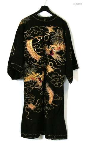 A 1930's Chinese Sing Fat Company embroidered silk robe decorated with dragons.