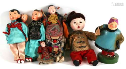 A group of antique and later Chinese and Japanese dolls, 26.5cms (10.5ins) high.