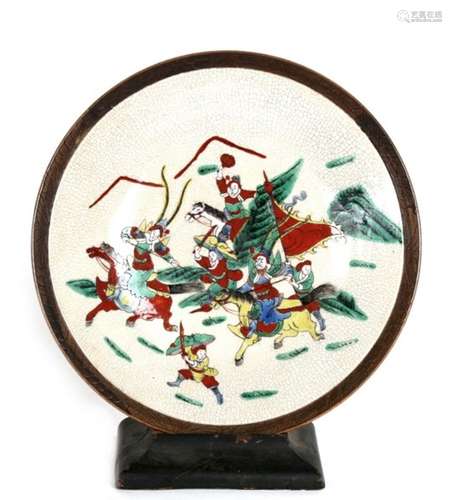 A Chinese crackle glaze charger decorated with warriors, incised four character mark to underside,