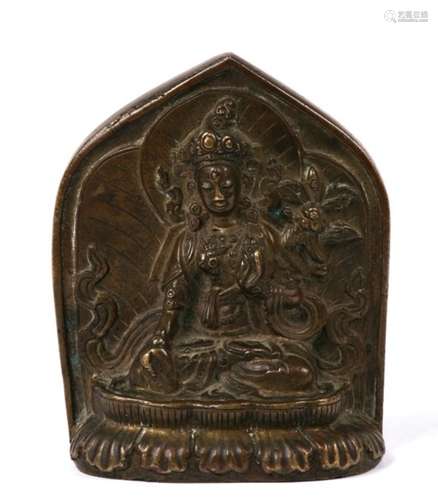 A Tibetan bronze figure of White Tara on a lotus base, with petal shape mandorla. Her head is