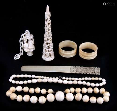 Two ivory bead necklaces, two napkin rings, and various Chinese ivory items.