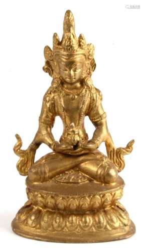 A Tibetan gilt bronze seated Buddha. 12cm 5 inches.