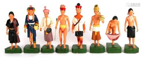 A collection of eight Burmese carved and painted figures of native Shan people, bearing labels 'SHAN