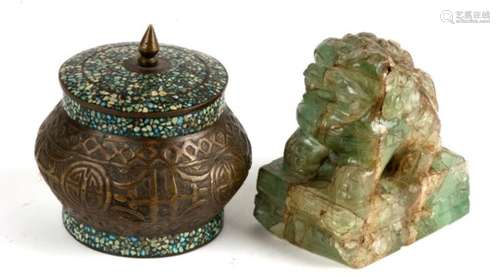 A jade or hardstone fo dog, 9cms (3.5ins) high; together with a Persian brass lidded box, 9cms (3.