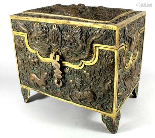 A Chinese / Tibetan parcel gilt copper repousse box, decorated dragons & mythical creaturesCondition