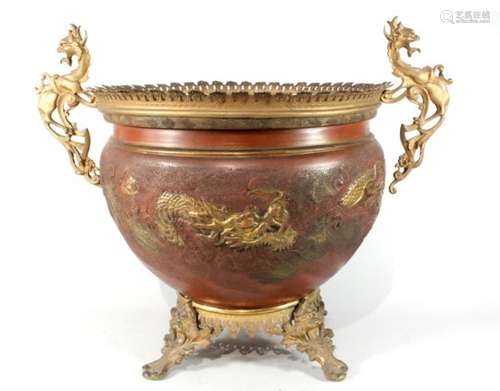 An ormolu mounted oriental redware vase